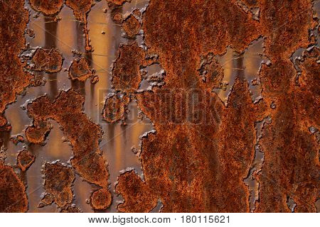 rusty metal plate with flaking paint abstract background texture