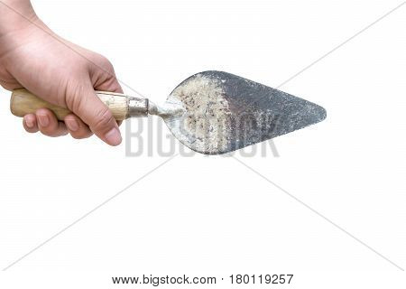hand holding old trowel isolated on white background with clipping path