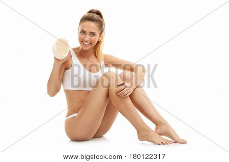 Woman with bath sponge isolated on white with healthy skin