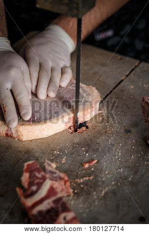 Butcher Is Slicing Beef Meat