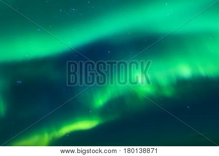 Aurora Borealis Known as Nother Lights Playing with Vivid Colors Over Lofoten Islands in Norway. Horizontal Image Orientation