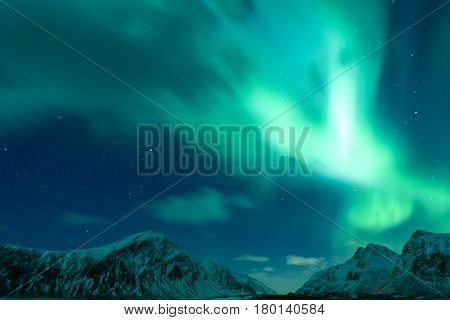 Aurora Borealis Known as Nother Lights Playing with Vivid Colors Over Lofoten Islands in Norway. Horizontal Image Orientation