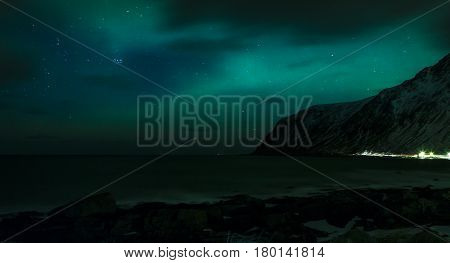 Aurora Borealis Known as Nother Lights Playing with Vivid Colors Over Lofoten Islands in Norway. Horizontal Image Orientation