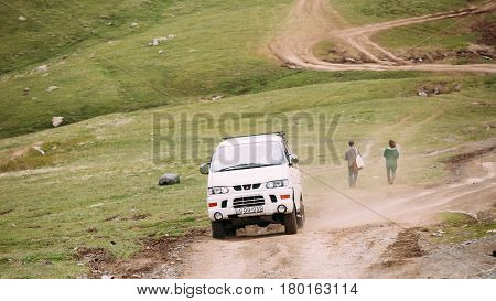 Truso Gorge, Georgia - May 22, 2016: Mitsubishi Delica Space Gear on country road in summer mountains landscape. Delica is a range of trucks and multi-purpose vehicles produced by Mitsubishi Motors.