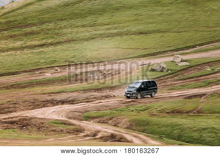 Truso Gorge, Georgia - May 22, 2016: Mitsubishi Delica Space Gear on country road in summer mountains landscape. Delica is a range of trucks and multi-purpose vehicles produced by Mitsubishi Motors.