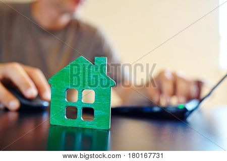 wooden house on the office table
