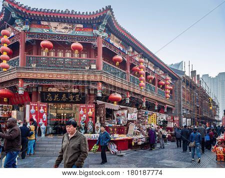 Tianjin, China - Nov 1, 2016: Tianjin Ancient Cultural Street; shop buildings preserved in the classical Qing Dynasty architectural style. Morning scene to what is a very popular tourist area.