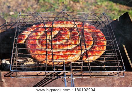 Beef Sausages Grilled On A Coals. Kielbasa Barbecue