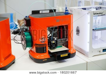 Hannover, Germany - March, 2017: 3d printer Da Vinchi mini printing close up process on exhibition Cebit 2017 in Hannover Messe, Germany