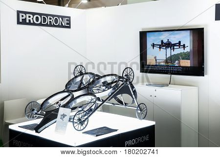 Hannover, Germany - March, 2017: Prodrone company with dual robot arm large drone participating in exhibition fair Cebit 2017 in Hannover Messe, Germany