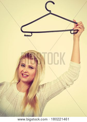 Blonde Woman Holding Clothes Hanger