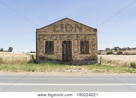 Kapunda South Australia Australia - December 3 2016: Old stone grocery store built in 1854 advertising with a faded Lion Coffee lettering on it's front. Situated on Elizabeth Street.