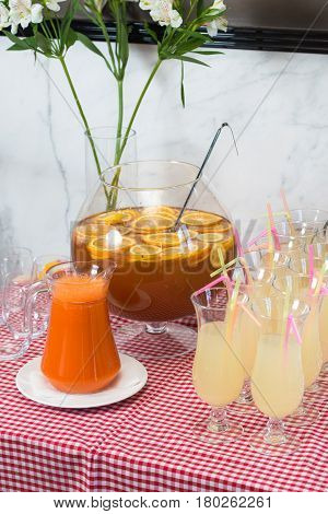 Fresh juice on a table in a restaurant. Healthy drinks. carrot fresh in a jar.