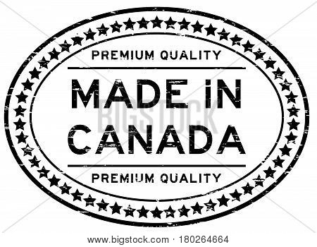 Grunge black premium quality made in Canada oval rubber seal stamp on white background
