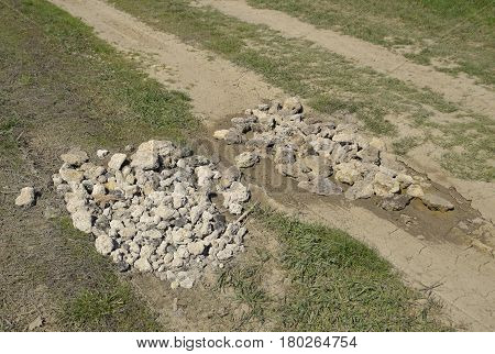 Road Patching. Pits On The Road Are Covered With Stones