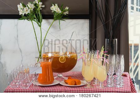 Fresh juice on a table in a restaurant. Healthy drinks. carrot fresh in a jar.