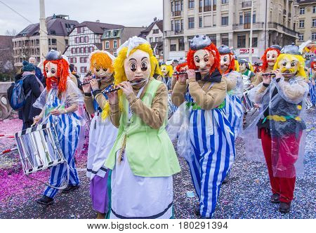 BASEL SWITZERLAND - MARCH 08 : Participants in the Basel Carnival in Basel Switzerland on March 08 2017. The Basel carnival has been listed as one of the top local festivities in Europe