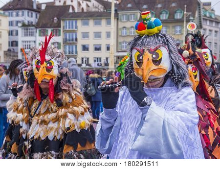 BASEL SWITZERLAND - MARCH 08 : Participants in the Basel Carnival in Basel Switzerland on March 08 2017. The Basel carnival has been listed as one of the top local festivities in Europe