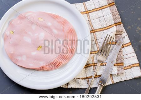 Close Up Of Mortadella On A White Plate