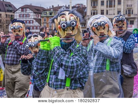 BASEL SWITZERLAND - MARCH 08 : Participants in the Basel Carnival in Basel Switzerland on March 08 2017. The Basel carnival has been listed as one of the top local festivities in Europe
