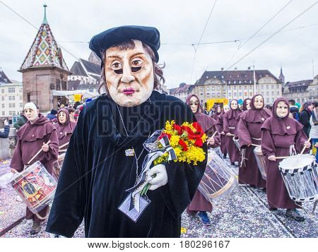 BASEL SWITZERLAND - MARCH 08 : Participants in the Basel Carnival in Basel Switzerland on March 08 2017. The Basel carnival has been listed as one of the top local festivities in Europe