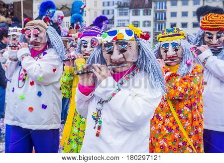 BASEL SWITZERLAND - MARCH 08 : Participants in the Basel Carnival in Basel Switzerland on March 08 2017. The Basel carnival has been listed as one of the top local festivities in Europe