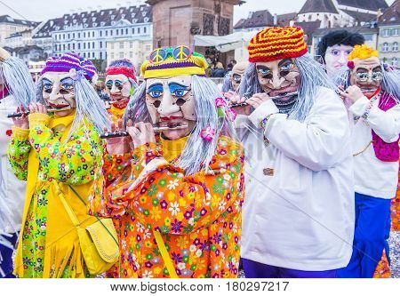 BASEL SWITZERLAND - MARCH 08 : Participants in the Basel Carnival in Basel Switzerland on March 08 2017. The Basel carnival has been listed as one of the top local festivities in Europe