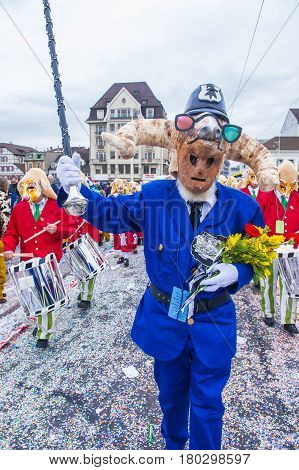 BASEL SWITZERLAND - MARCH 08 : Participants in the Basel Carnival in Basel Switzerland on March 08 2017. The Basel carnival has been listed as one of the top local festivities in Europe