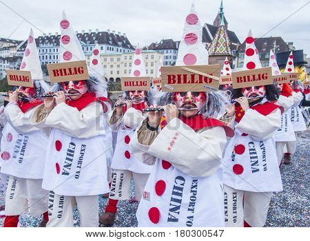 BASEL SWITZERLAND - MARCH 08 : Participants in the Basel Carnival in Basel Switzerland on March 08 2017. The Basel carnival has been listed as one of the top local festivities in Europe