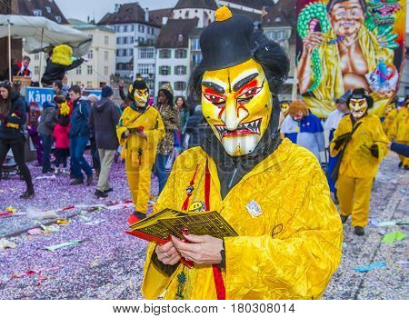 BASEL SWITZERLAND - MARCH 08 : Participants in the Basel Carnival in Basel Switzerland on March 08 2017. The Basel carnival has been listed as one of the top local festivities in Europe