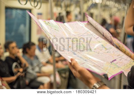 Mrt Subway Train, Tourist Looks Location On Map