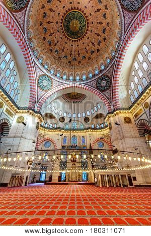 ISTANBUL - MAY 25, 2013: Inside the Suleymaniye Mosque in Istanbul, Turkey. The Suleymaniye Mosque is the largest mosque in the city and one of the best-known sights of Istanbul.