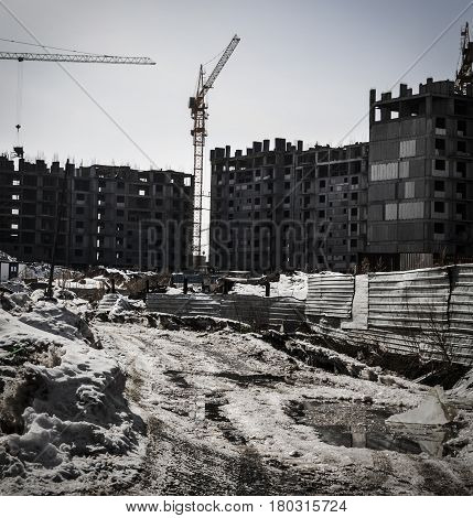 Building under construction, apartment buildings, construction crane, multi-storey buildings