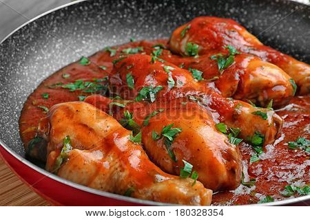 Frying pan with chicken cacciatore, closeup