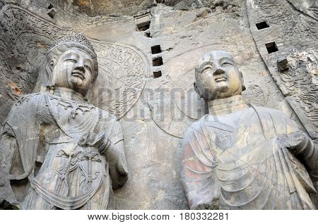 A stone Buddha statues Fengxiansi cave at Longmen grottoes in Luoyang China Henan province.
