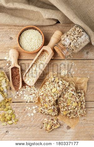 Healthy Snack - Crispy Cereal Cookies On Old Wooden Table And Ingredients: Oat Flakes, Flax Seed, Pu