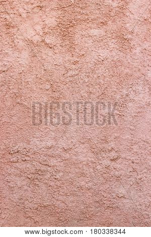 Pink texture of a relief concrete wall