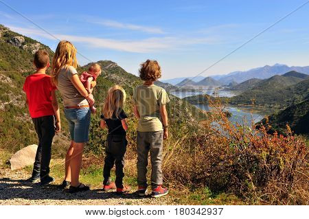 Family standing at viewpoint of Rieka Crnojevica Montenegro.