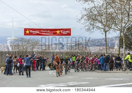 Barcelona Spain - March27 2016: The peloton riding during Volta Ciclista a Catalunya on the top of Montjuic in Bracelona Spain on March 27 2016.