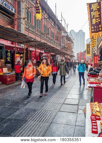 Tianjin, China - Nov 1, 2016: Tianjin Ancient Cultural Street; shop buildings preserved in the classical Qing Dynasty architectural style. Morning scene to what is a very popular tourist area.