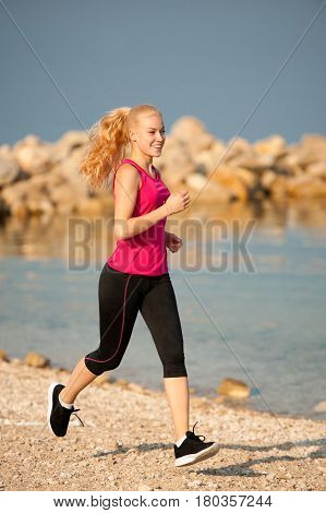Jogging In Th Beach - Woman Runns Near Sea On Early Summer Morning