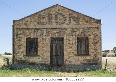 Kapunda South Australia Australia - December 3 2016: Old stone grocery store built in 1854 advertising with a faded Lion Coffee lettering on it's front. Situated on Elizabeth Street.