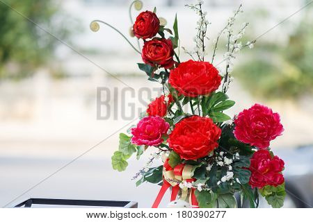 Batch of red carnation flower in glass