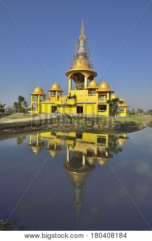 Building a new temple in Wat Rong Khun the White Temple art exhibit in the style of a Buddhist temple in Chiang Rai Province north Thailand.