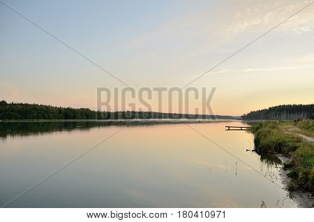 The calm lake at dawn in windless weather