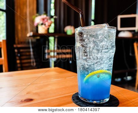 Glass Of Splash Blue Lemon Juice Soda On The Wood Table, Suumer And Fresh Concept