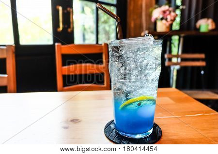 Glass Of Splash Blue Lemon Juice Soda On The Wood Table, Suumer And Fresh Concept