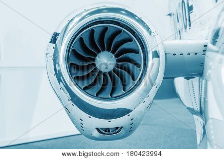 detailed insigh tturbine blades of an aircraft jet engine colored technical blue business jet engine close up high detailed view