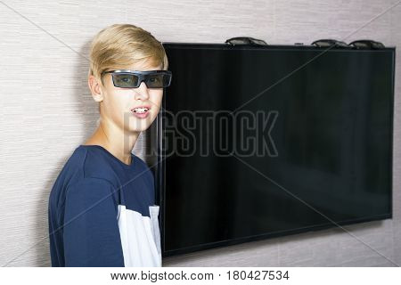 Portrait of smiling blonde boy in 3 D glasses
