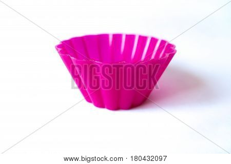 Bright pink silicone baking case for cupcakes